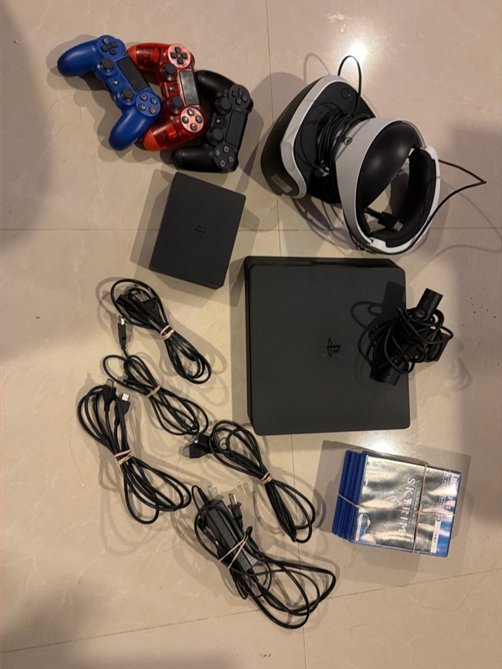 Sony PlayStation VR Headset with Black PS4 Slim Console and Blue/Red Controllers